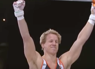 Illustration for article titled Dutch Gymnast Manages To Catch High Bar Release Move With One Hand, Wins Medal